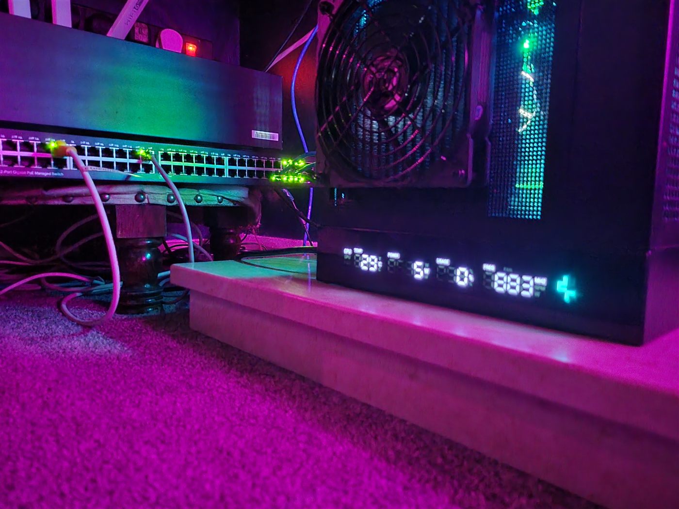 Nick's i9 Proxmox server and managed network switch, lit up
